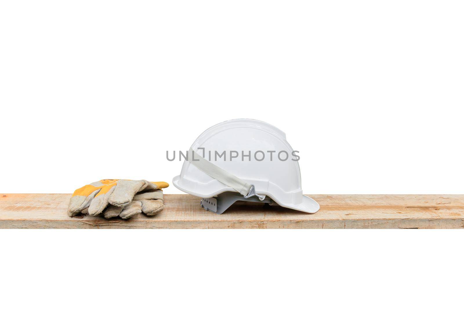 helmet plastic white and leather glove safety equipment construction of engineering on Wooden floor isolated  black background and clipping path by pramot