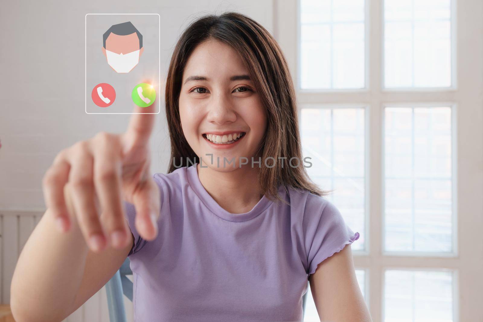 Portrait of beautiful woman and smiling using video call on visual screen with her parents. Quarantine and work from home concept