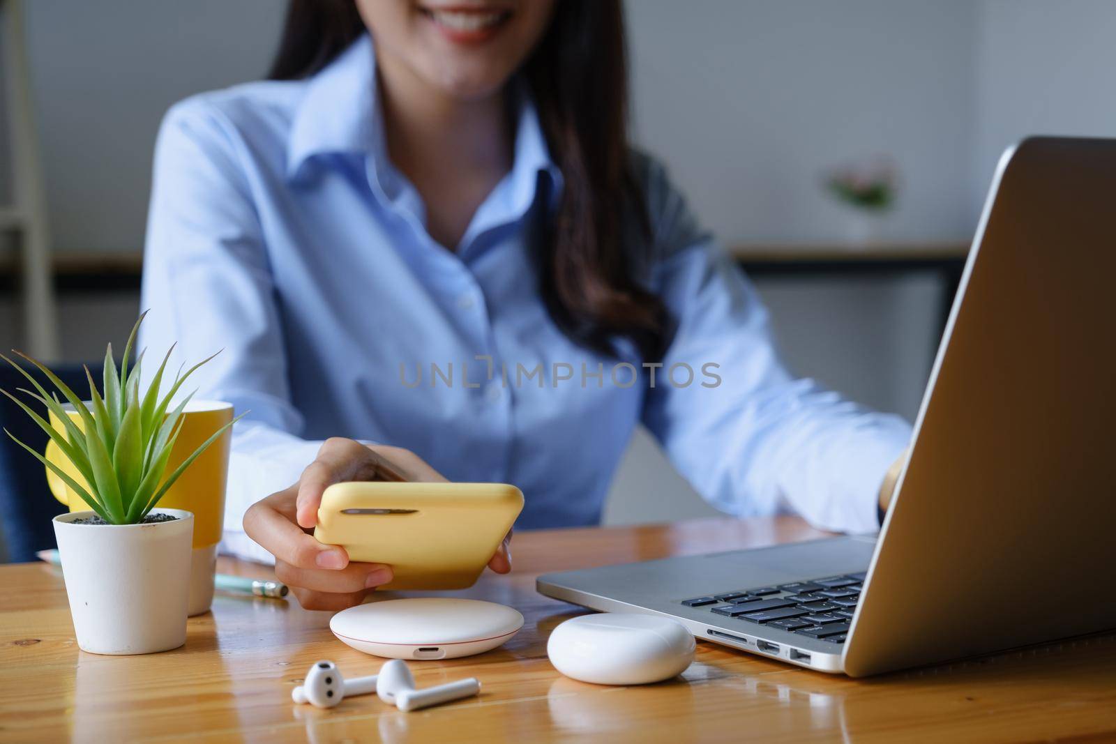 Woman using wireless charging . technology concept