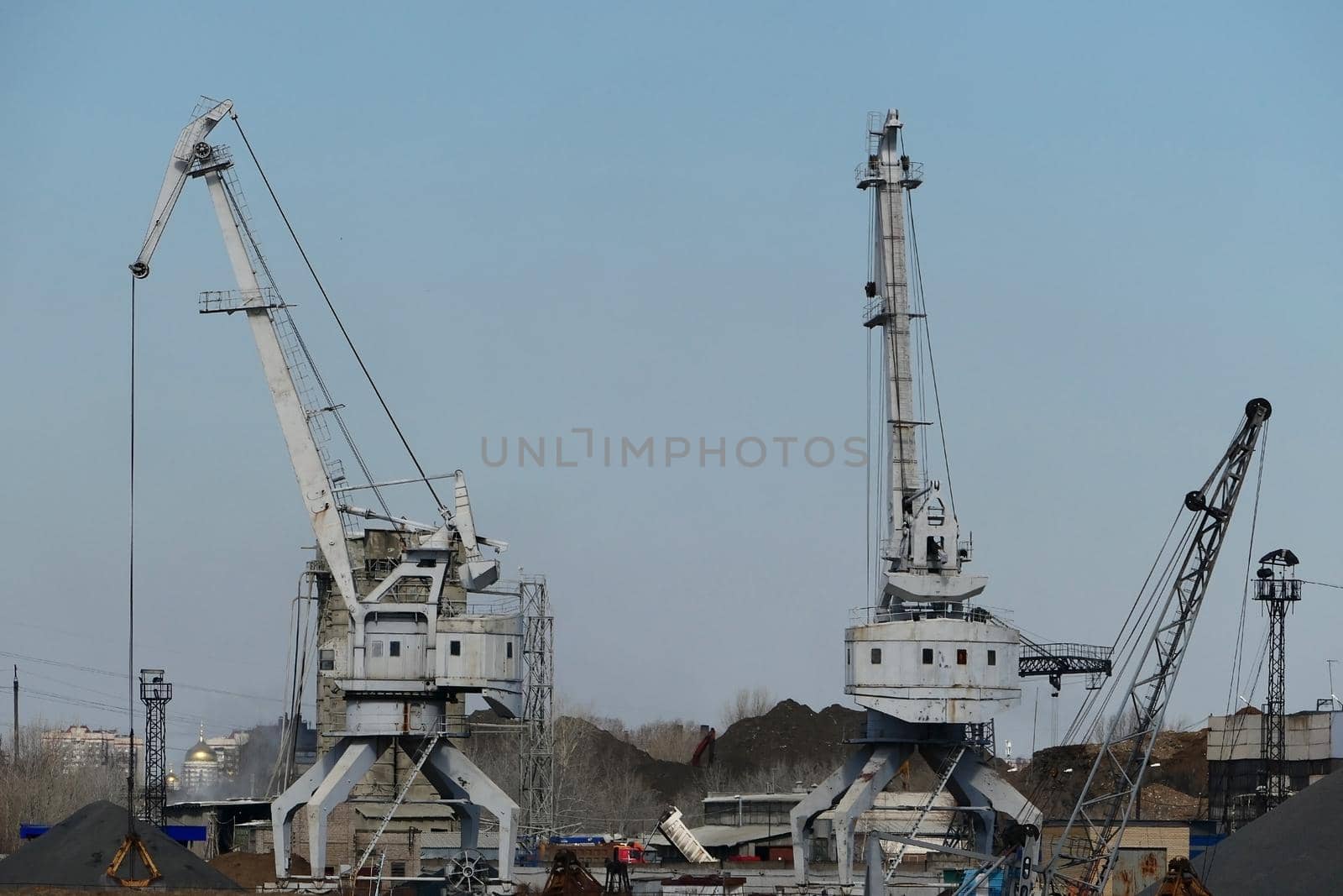 River port. The factory by the river. Sand mining. A crane and special equipment for loading sand. by Olga26