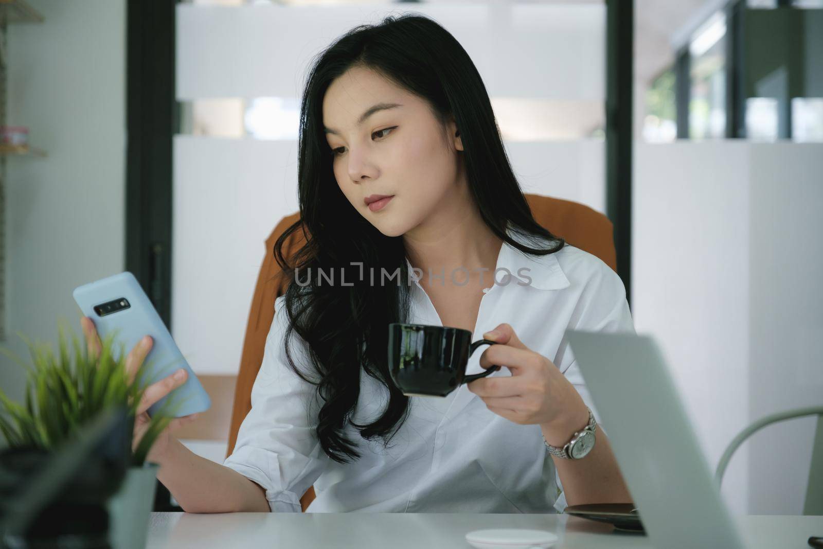 Portrait of Asian Business woman working from home. Accounting concept. by itchaznong