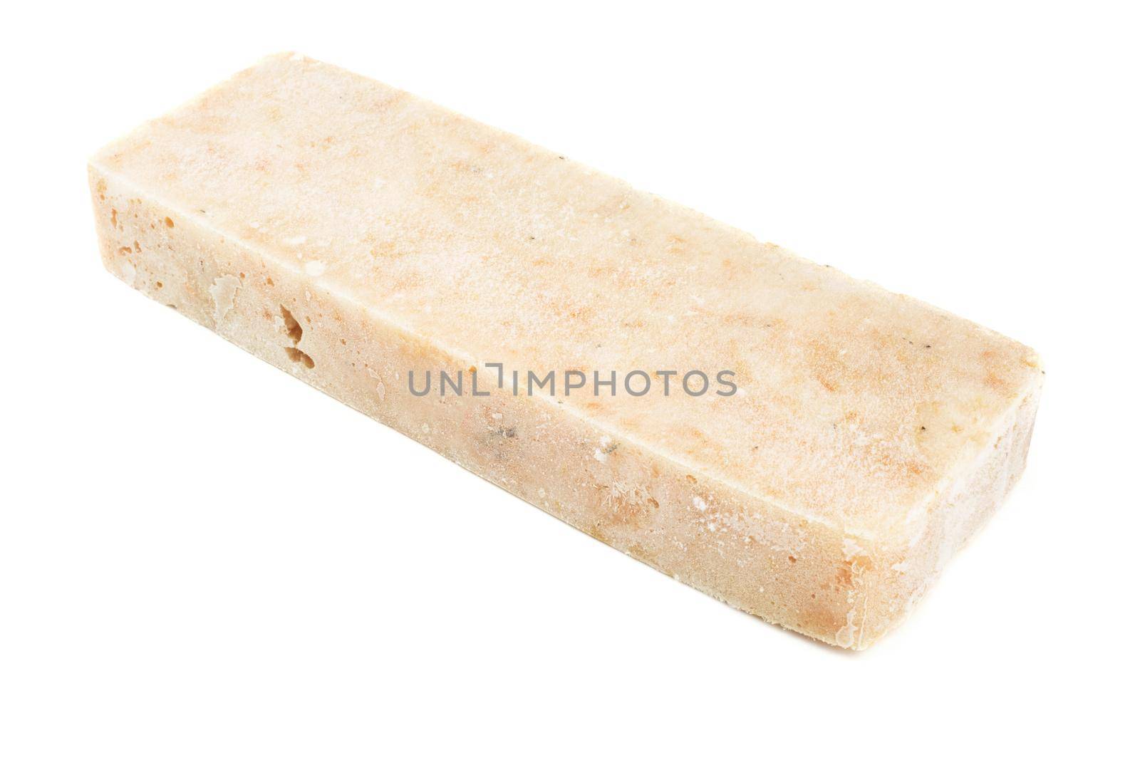 Frozen minced cod fish block isolated on white background, semifinished prepack