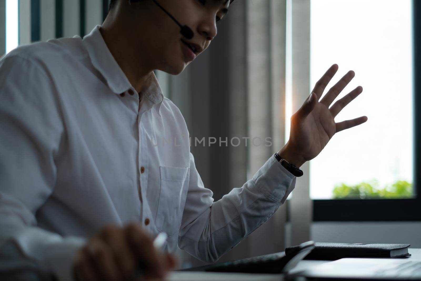 Businessman try to explain about his work to business team by video call at home office. Doctors are advising patients by video call at the hospital office. soft focus. by itchaznong