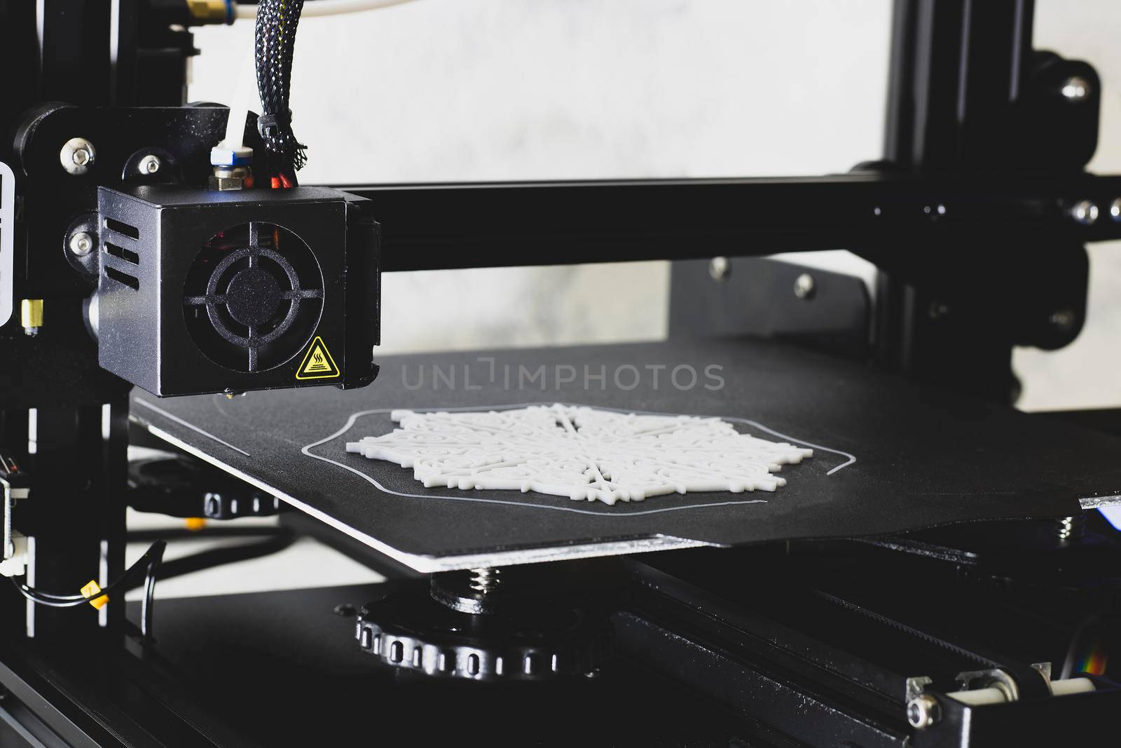 Snowflake printing on a 3D printer, 3D print details. Black and white image.