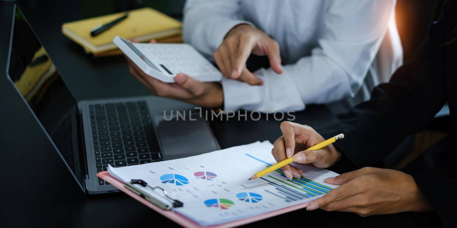 Group of Businesswoman and Accountant checking data document on digital tablet for investigation of corruption account . Anti Bribery concept. by itchaznong