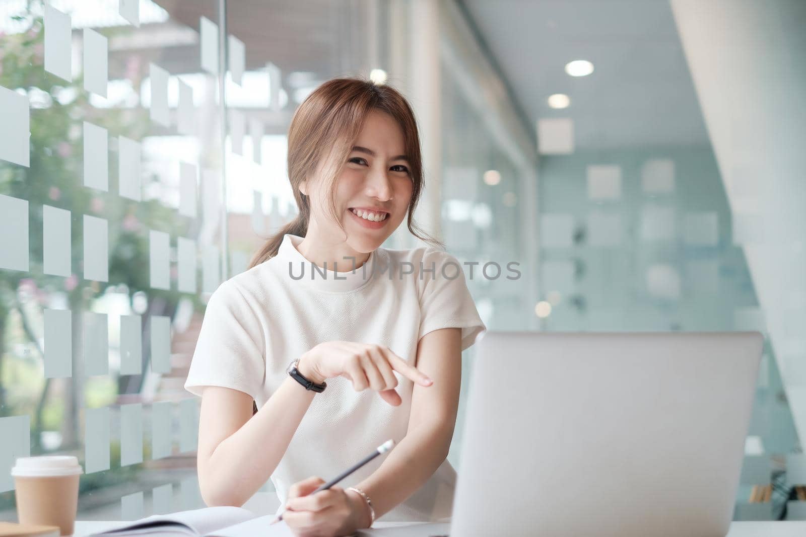 Positive beautiful woman happy with her job and work from home. business, account, finance, tax concept
