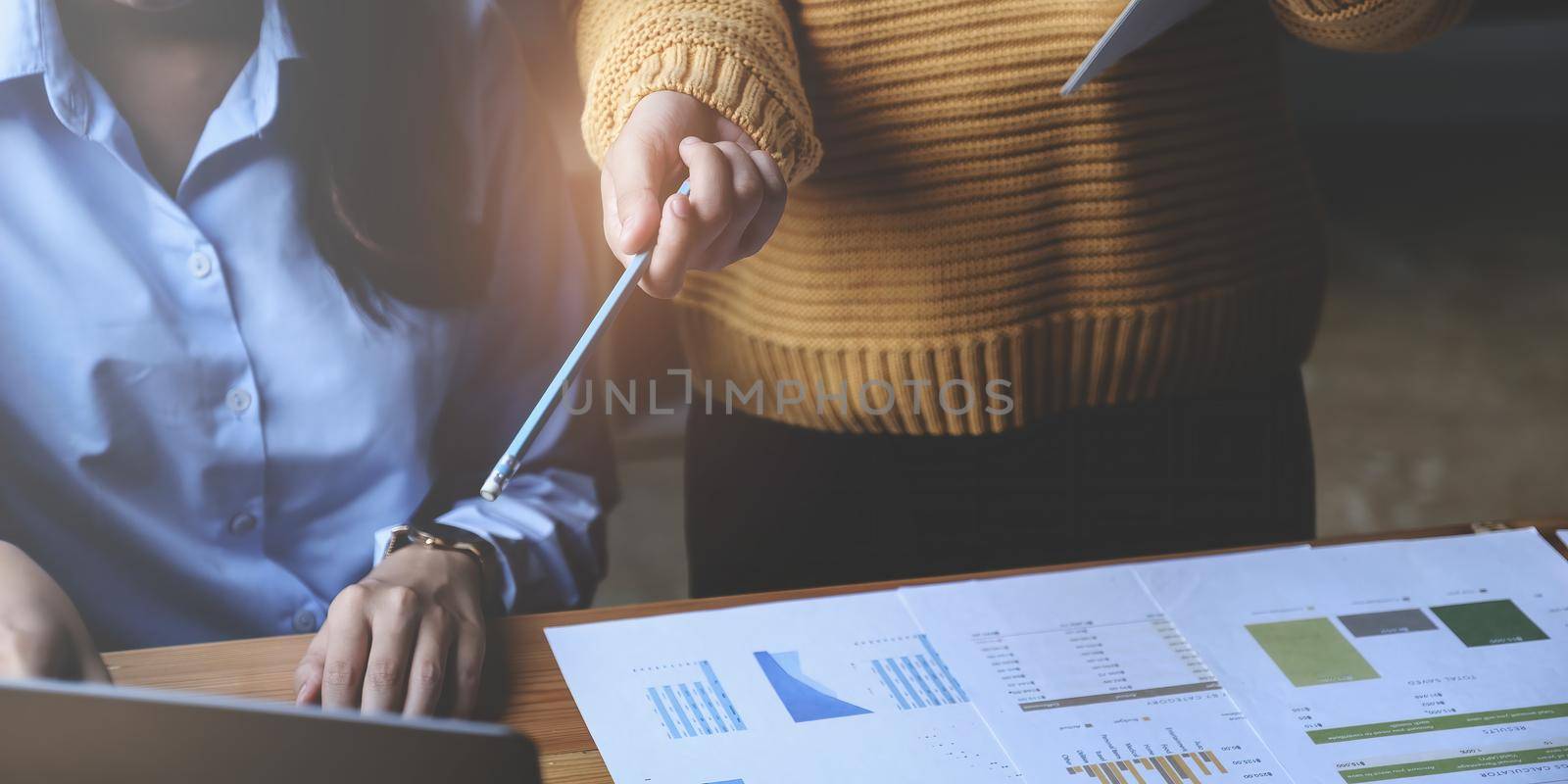 Analytics intelligence concept. Group of business people discuss current financial and economic on laptop for investment at the meeting. by itchaznong