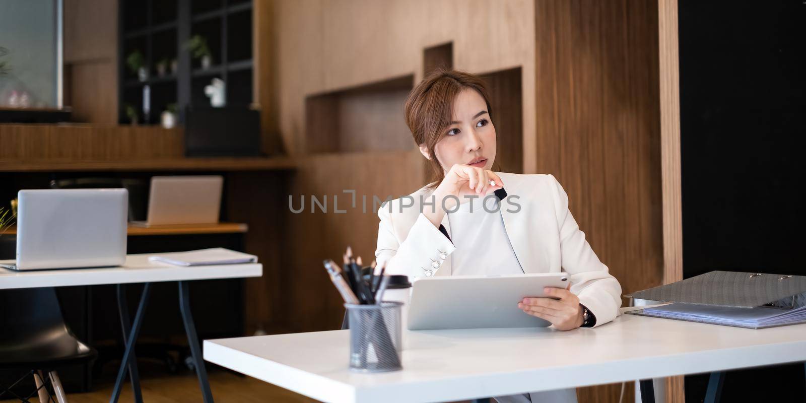 Fashion asian woman designer using digital tablet