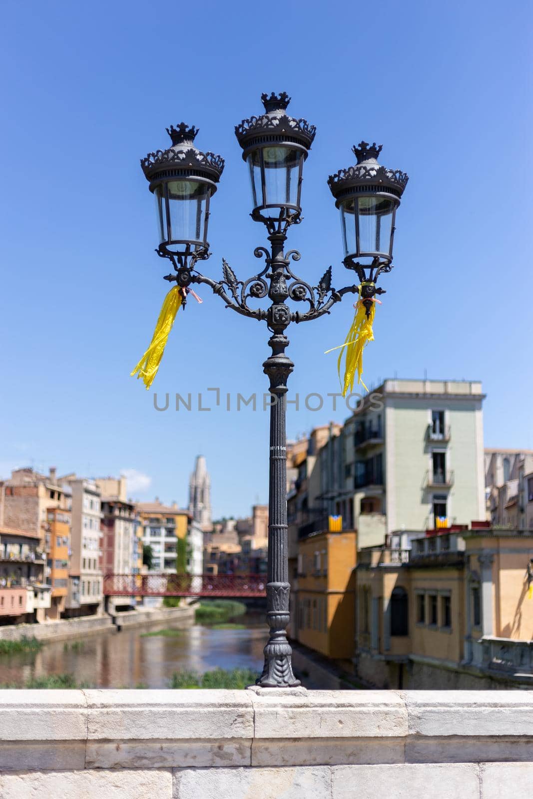 Ornate street lamp in the Spanish city of Girona by Digoarpi