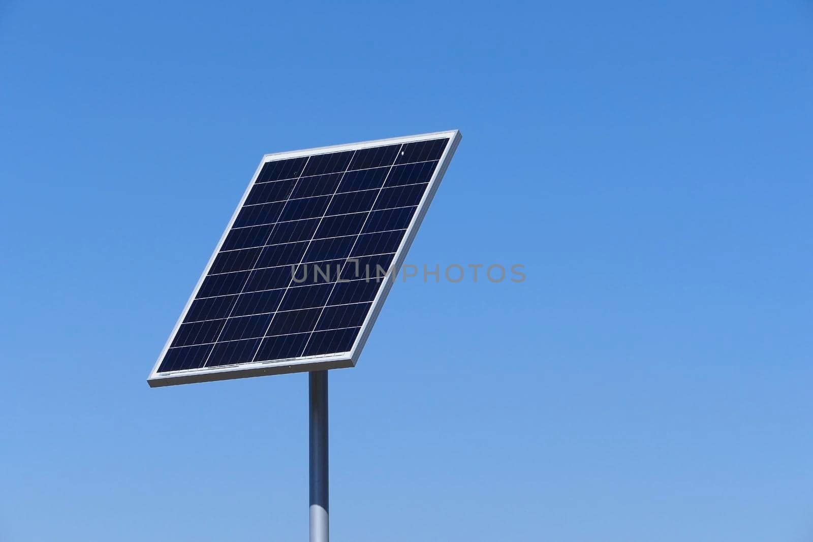 Solar panels or electric battery against the blue sky is isolated. High quality photo