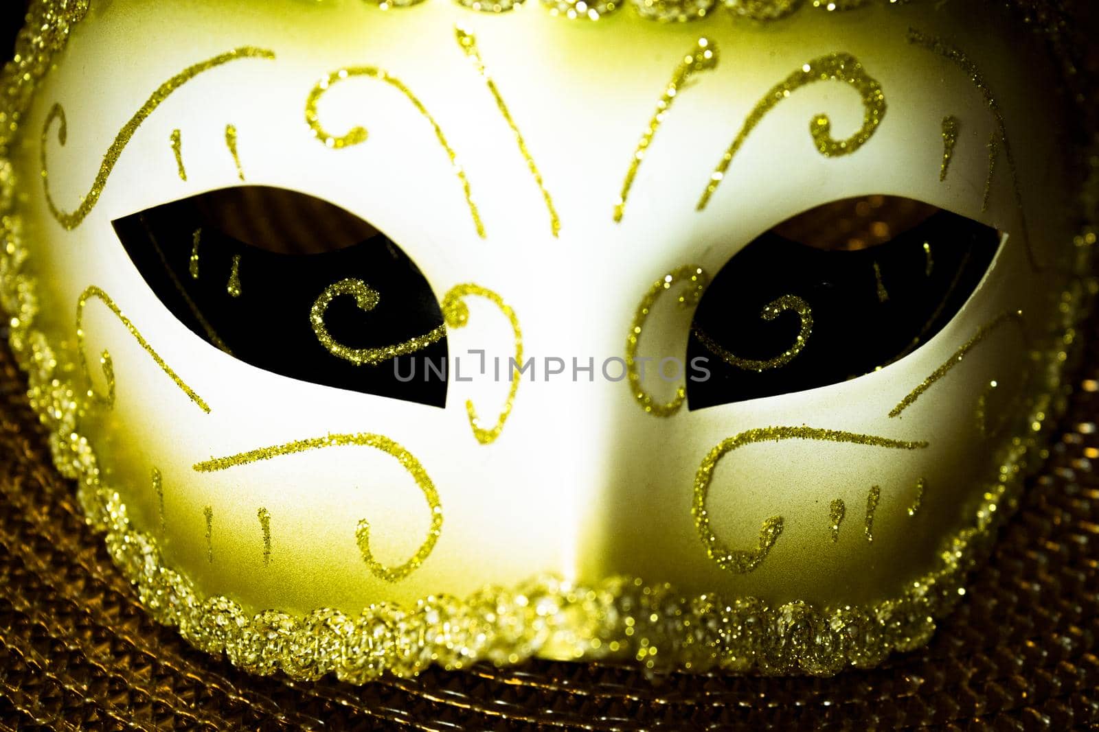 Woman mask to dress up. Beige and gold color. No people