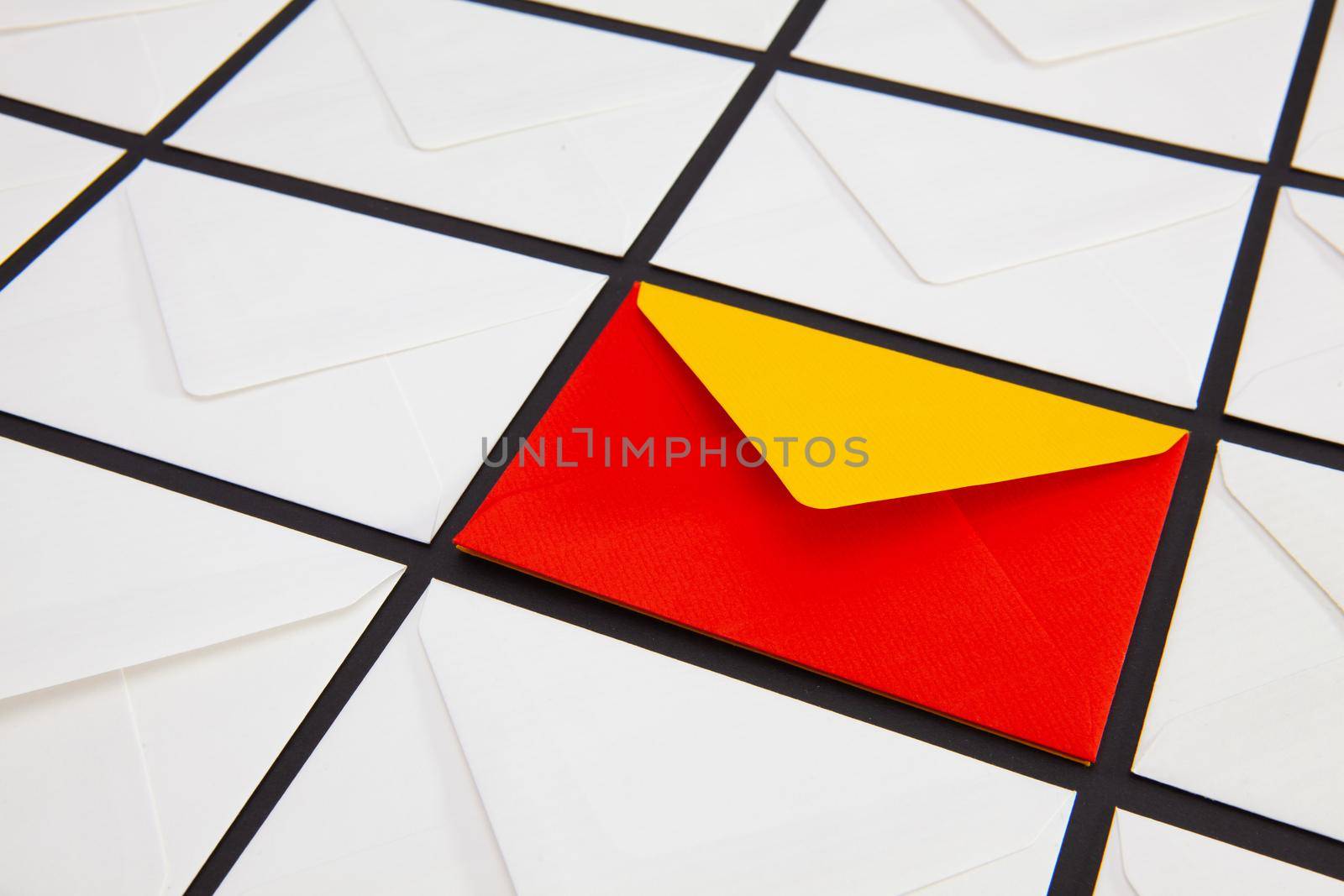 Composition with white and colored envelopes on the table. The photo suitable for various holidays and anniversaries.