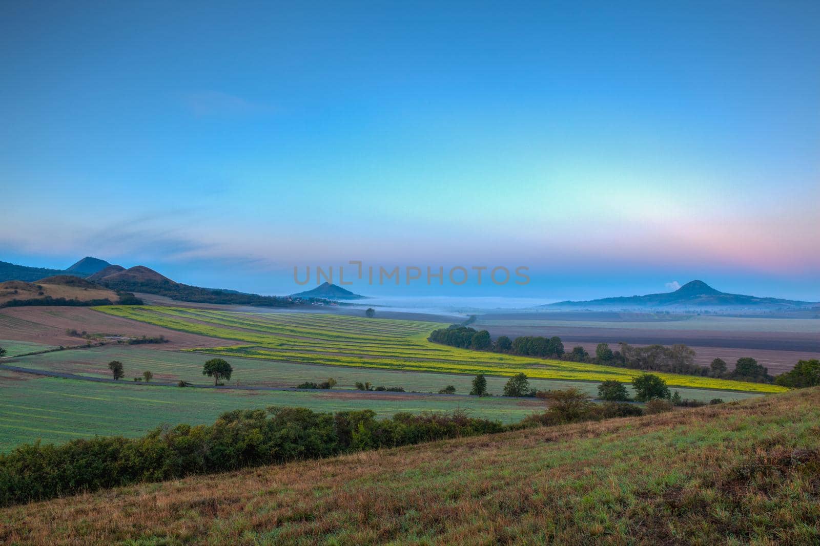 Misty morning in in Central Bohemian Uplands, Czech Republic. Central Bohemian Uplands is a mountain range located in northern Bohemia. The range is about 80 km long