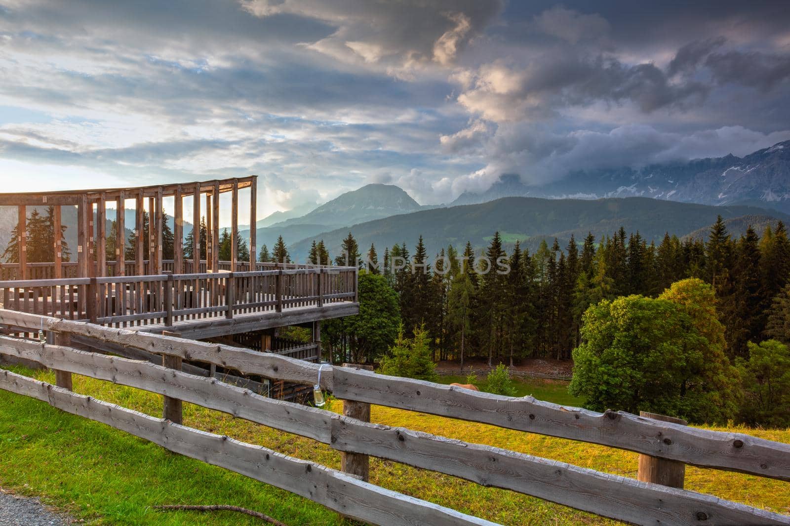 Dachstein mountain and summer valley views from Almwelt Austria resort.  Almwelt Austria is located 7 km from the city Schladming. The nicely furnished rooms are set in chalets.