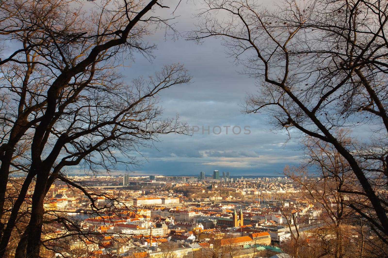 View from Petrin Park on Prague City at  sunset, Czech Republic. Aerial panoramic view of the histrical roofs. Prague, Czech Republic.