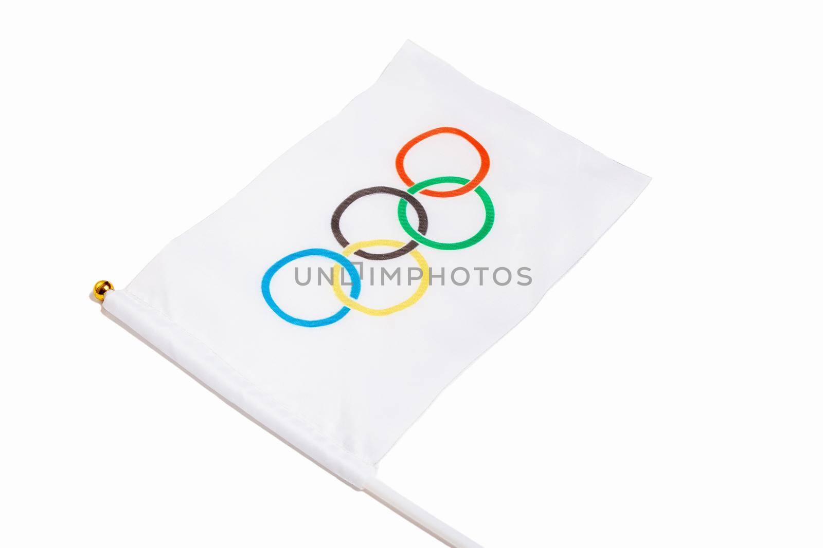 Miniature Olympic flag on a white background. Olympic Games symbol. Moscow Russia 7 April 2021
