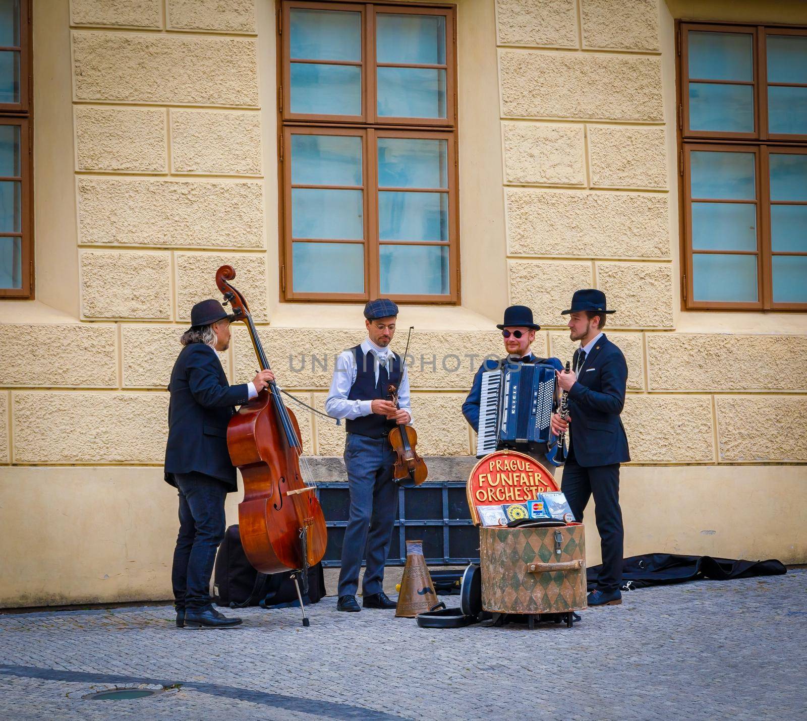 A jazz band is playing in the street, a group of male street musicians. Prague, Czech Republic, April 14, 2018