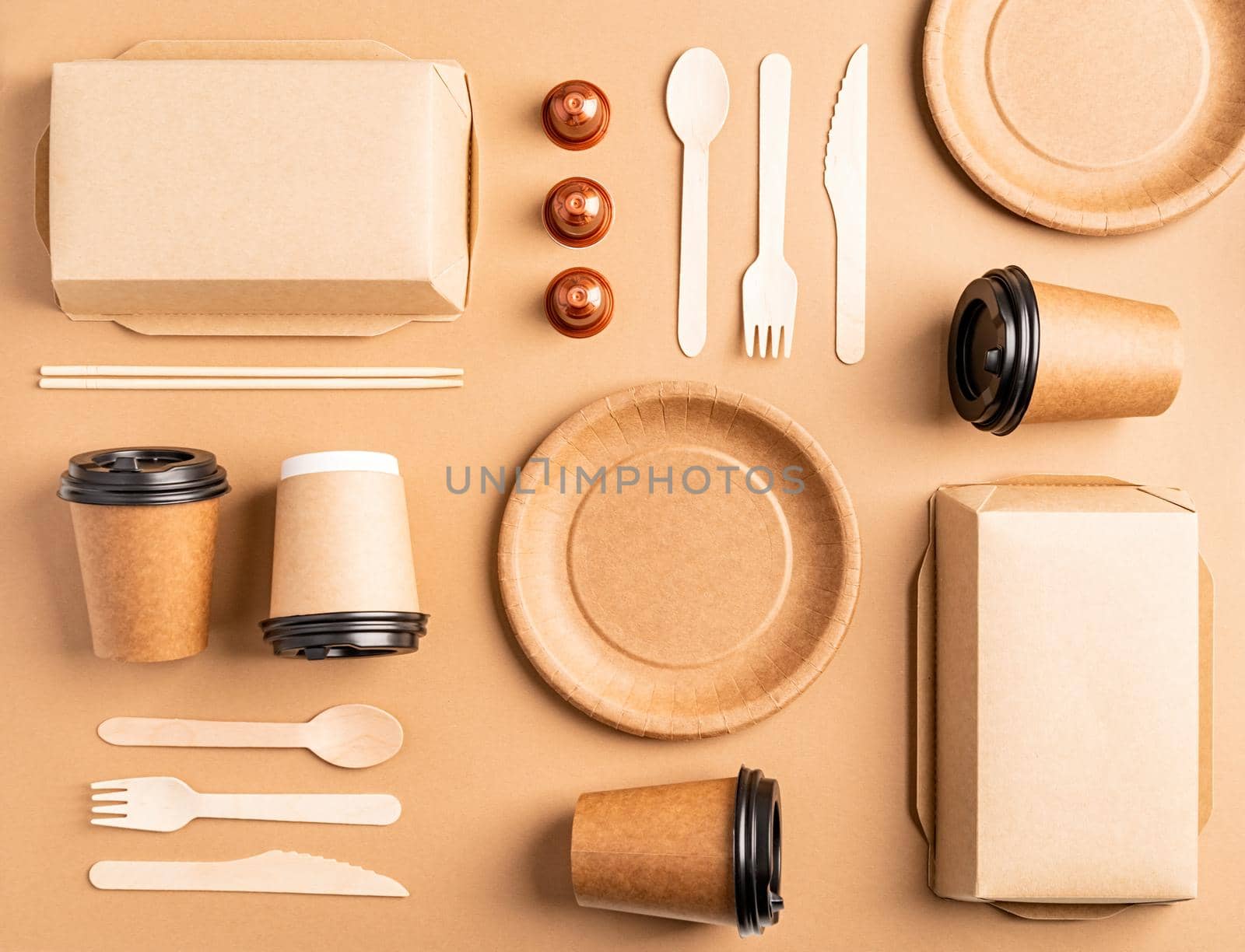 Knolling concept. Eco friendly zero waste disposable tableware top view flat lay on brown background. Pattern