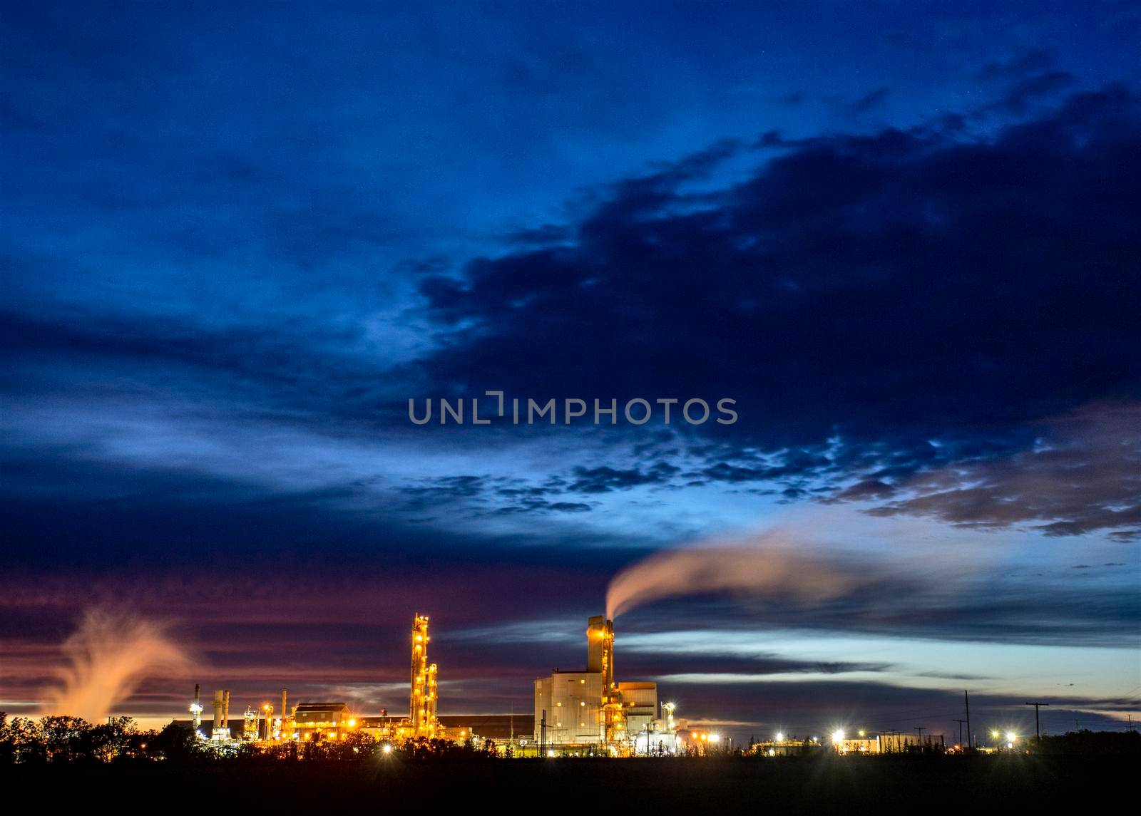 Ominous Storm Clouds Prairie night refinery Fertilizer