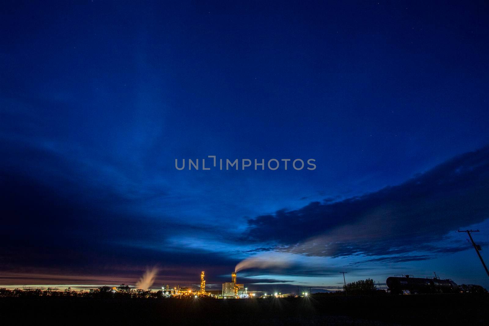 Ominous Storm Clouds Prairie night refinery Fertilizer