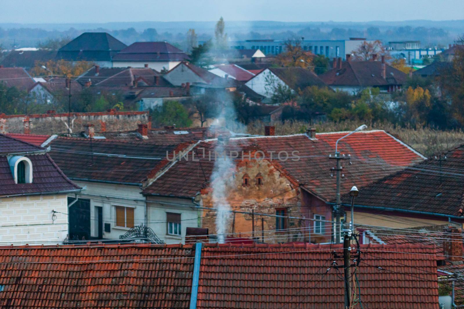 Overview of tile rooftops of old houses. Old buildings architecture.