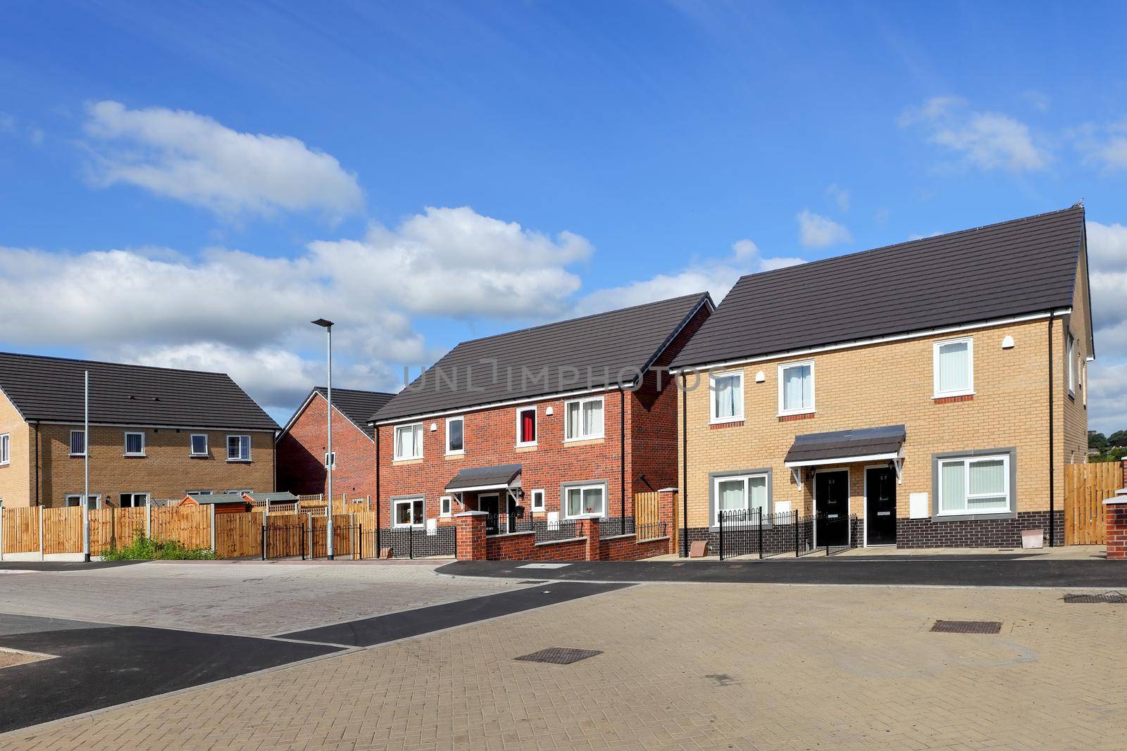 New and modern english houses on blue sky