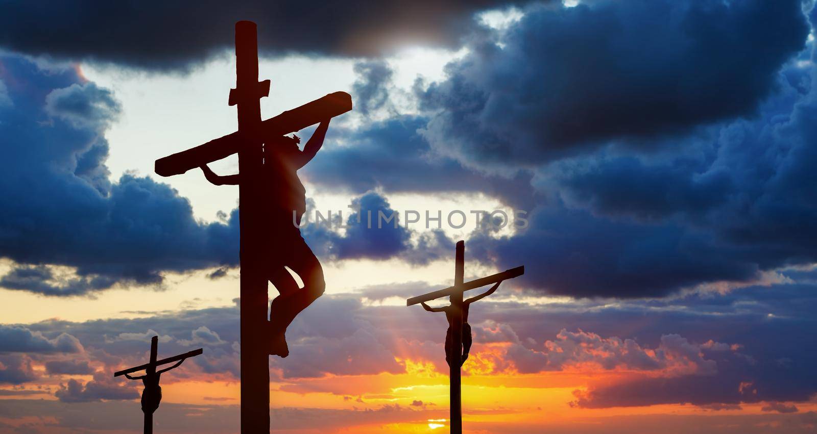 Silhouette of three crosses on Calvary hill