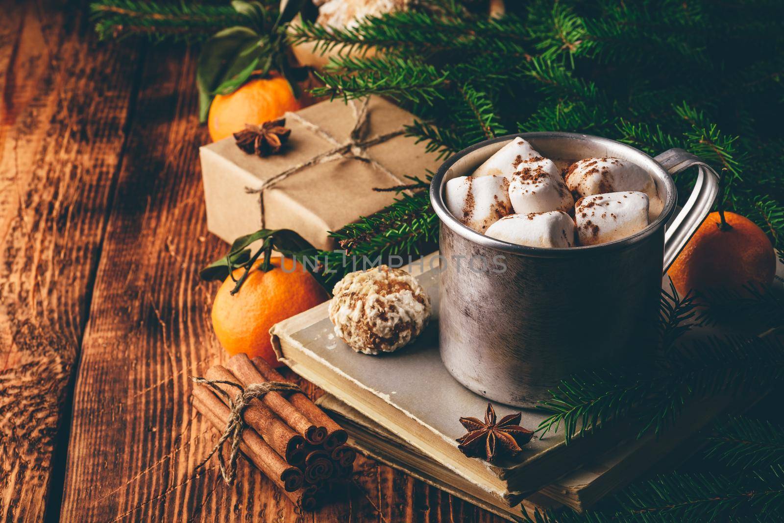 Mug of hot chocolate with marshmallows over wooden table