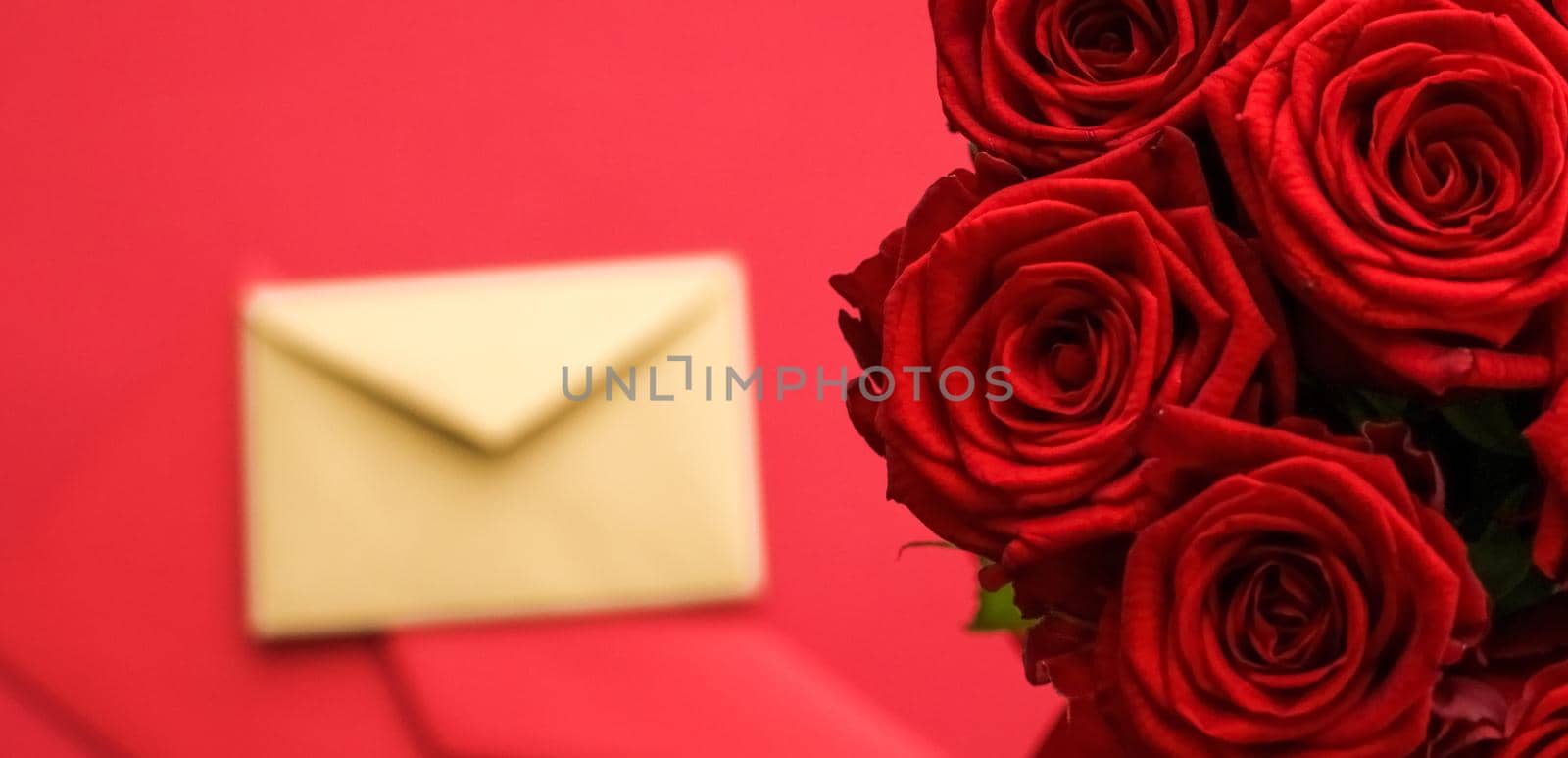 Love letter and flower delivery service on Valentines Day, luxury bouquet of red roses and card envelopes on red background by Anneleven