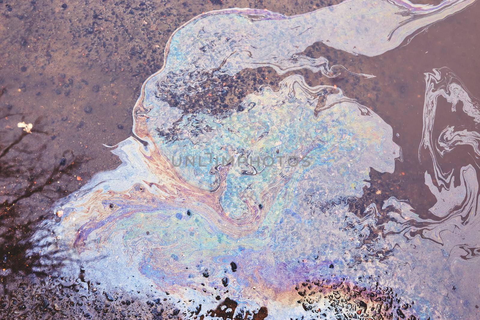 Oil stain on Asphalt, color Gasoline fuel spots on Asphalt Road as Texture or Background