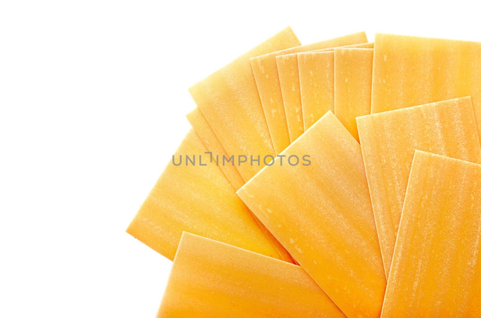 Uncooked lasagna pasta isolated on white background