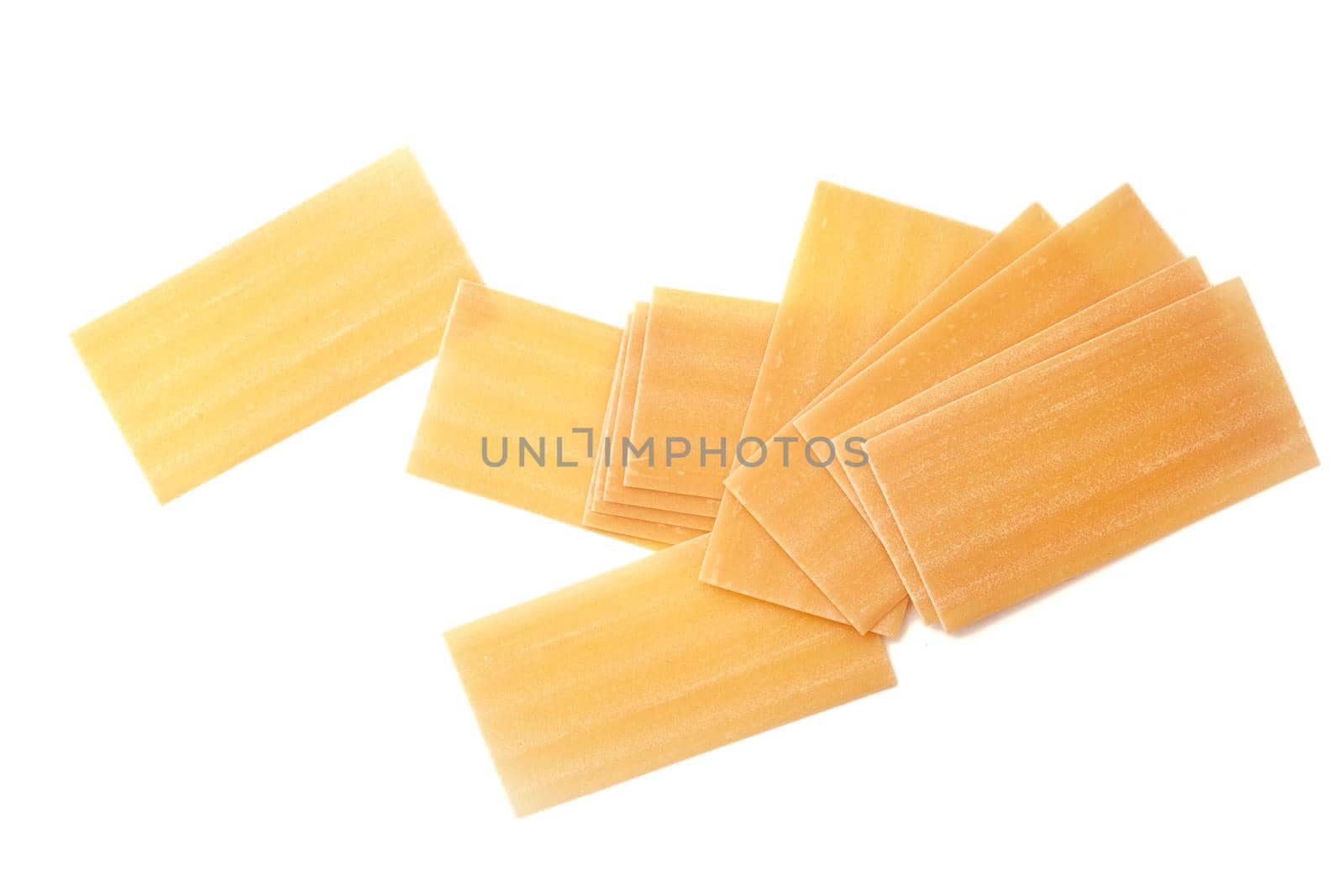 Uncooked Italian lasagna, pasta isolated on white background