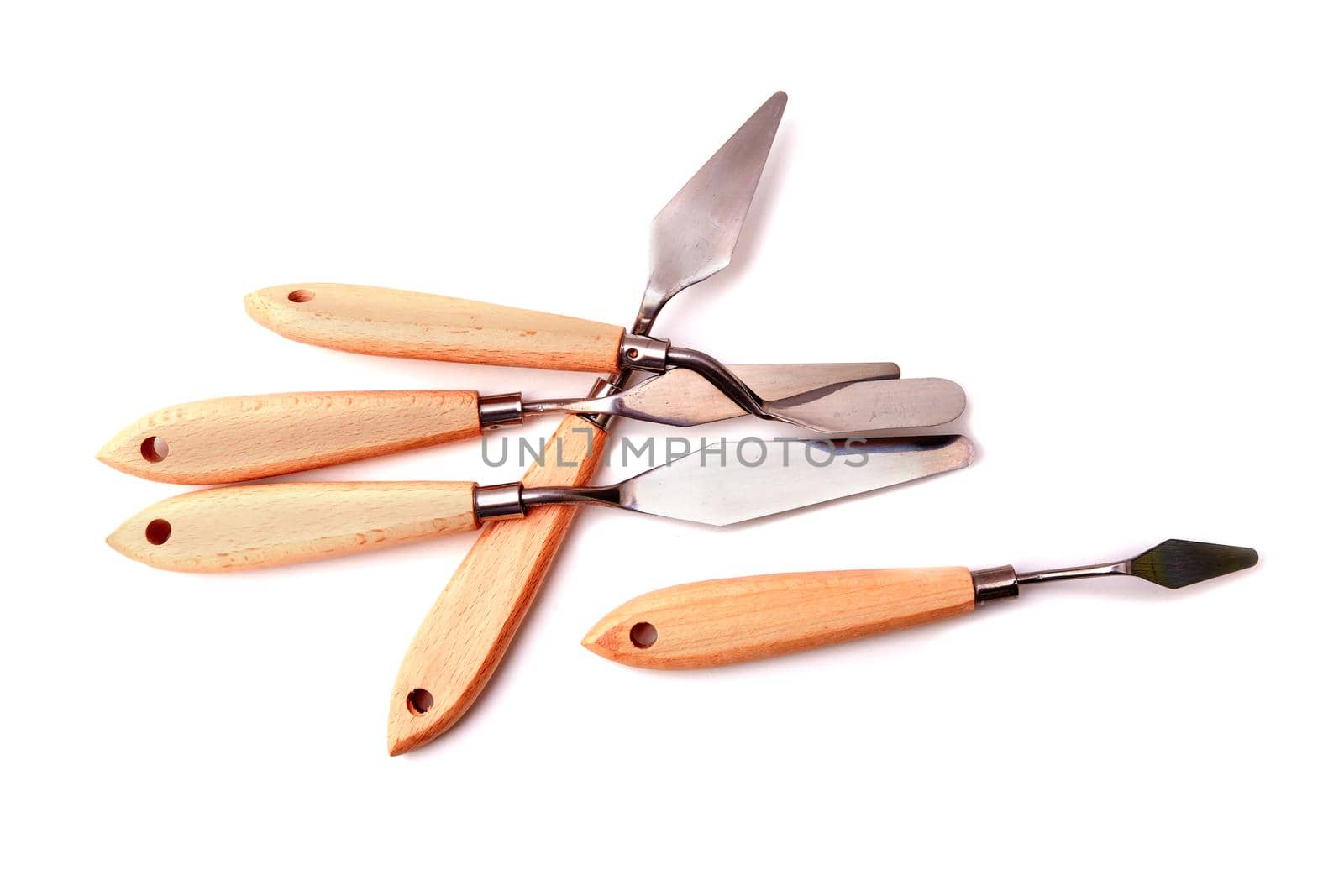 a set of palette knives for drawing on a white background