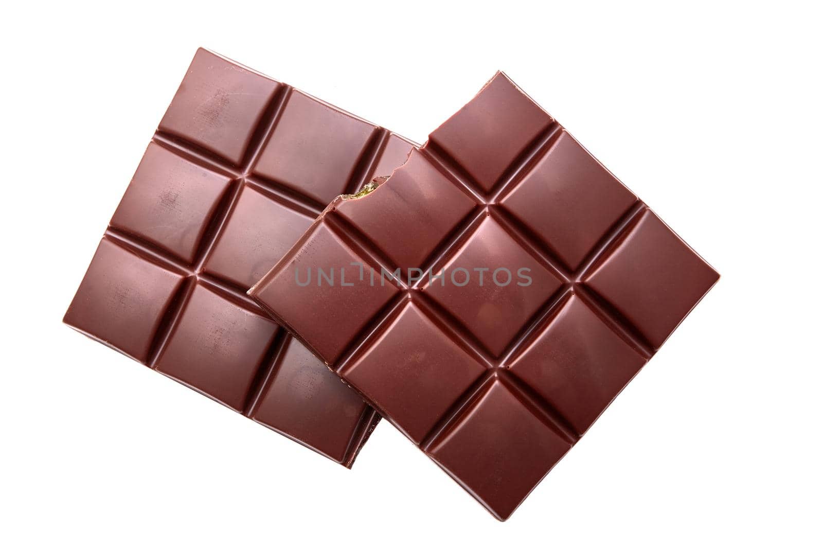 two pieces of chocolate isolated on white close-up