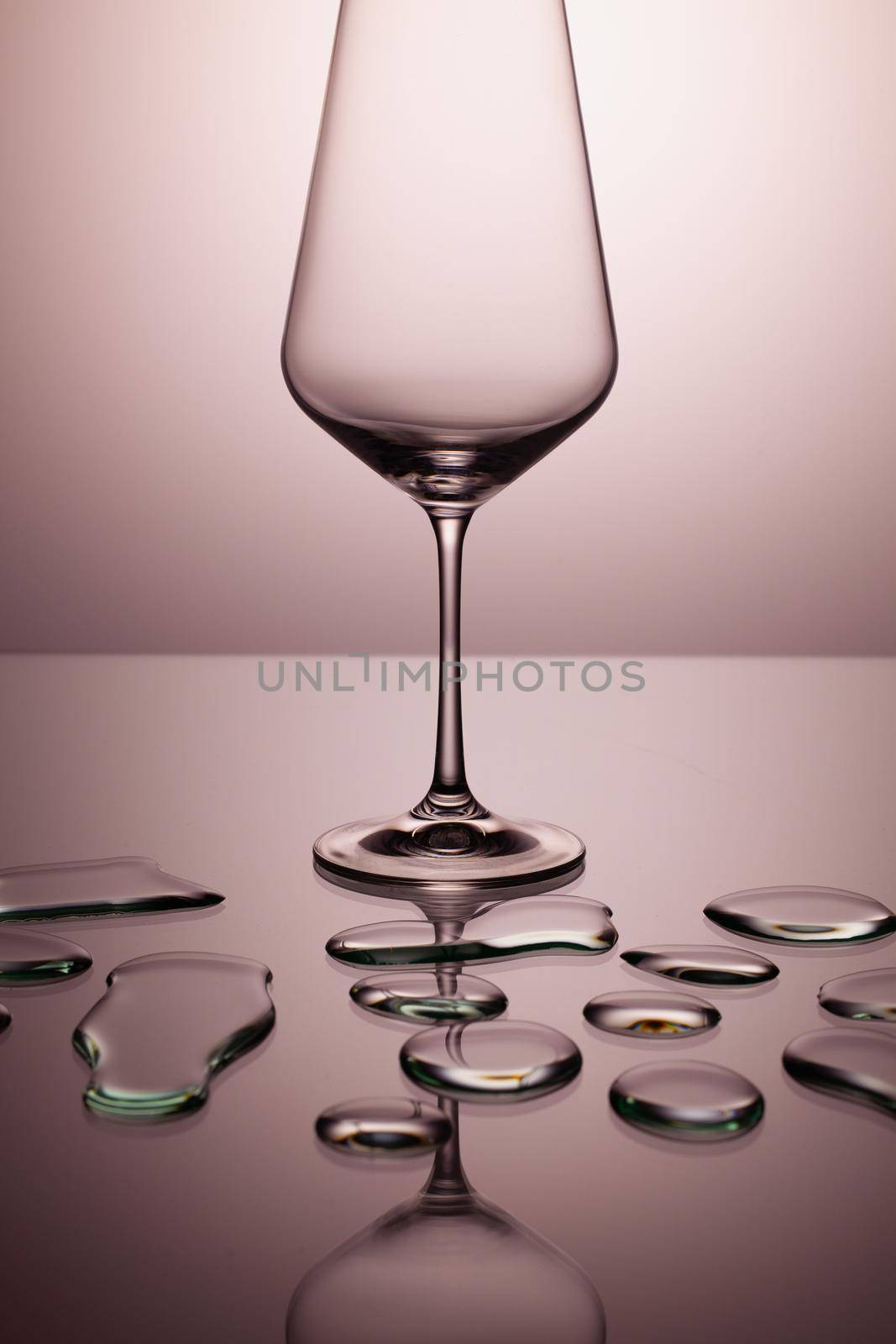 Empty wine glasses on a clean gradient background.  by CaptureLight