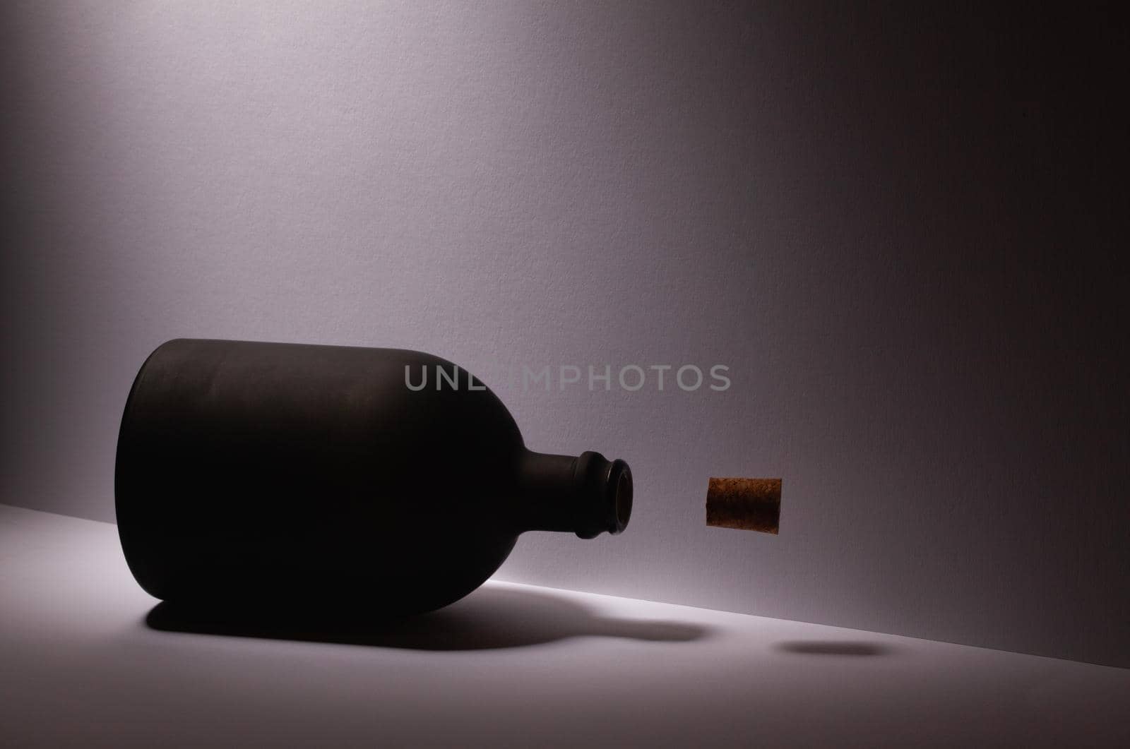 Luxury Black Glass of Rum on the white background by CaptureLight