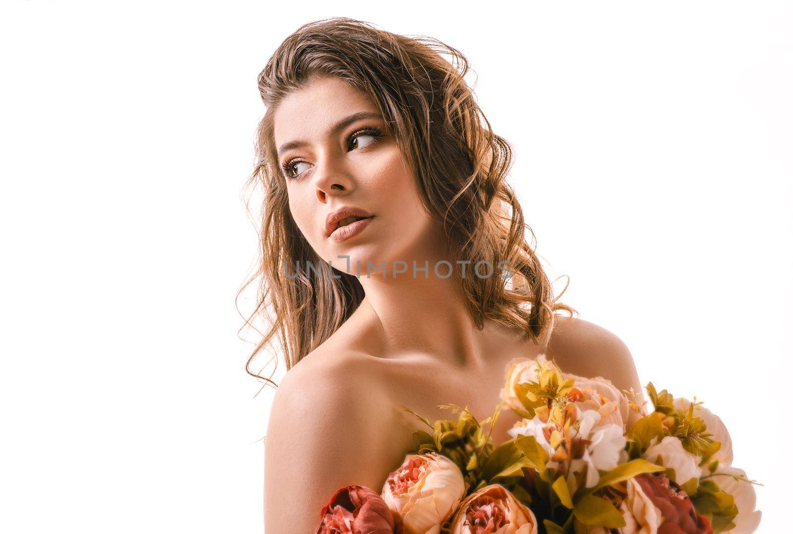 Beautiful girl closing her eyes posing in studio isolated on white background.