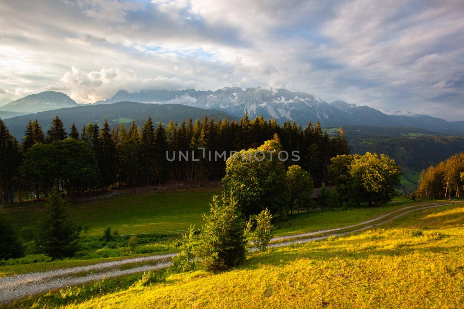 Dachstein mountain and summer valley views from Almwelt Austria resort.  Almwelt Austria is located 7 km from the city Schladming. The nicely furnished rooms are set in chalets.