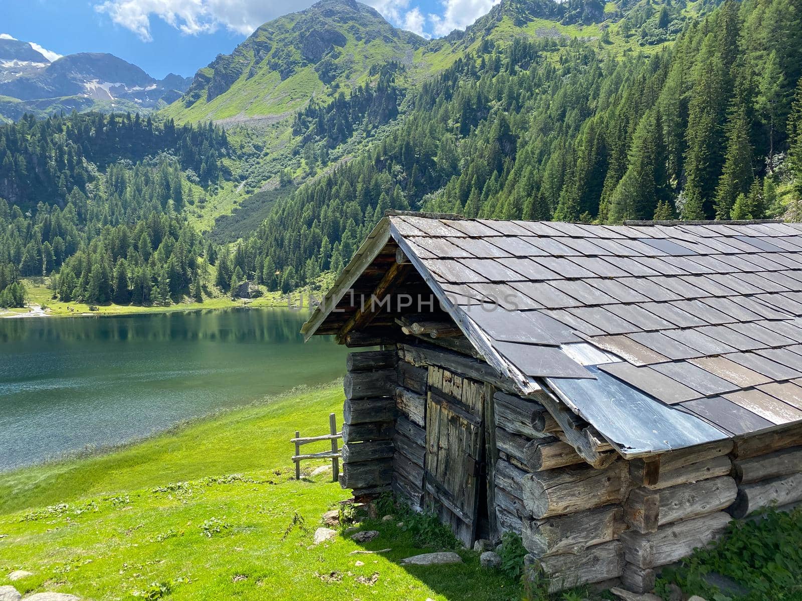 Very old barn, Duisitzkarsee Lake in Austria.The Duisitzkarsee is probably one of the most beautiful mountain lakes in the Schladminger Tauern.The place without  tourists after the coronavirus pandemic.