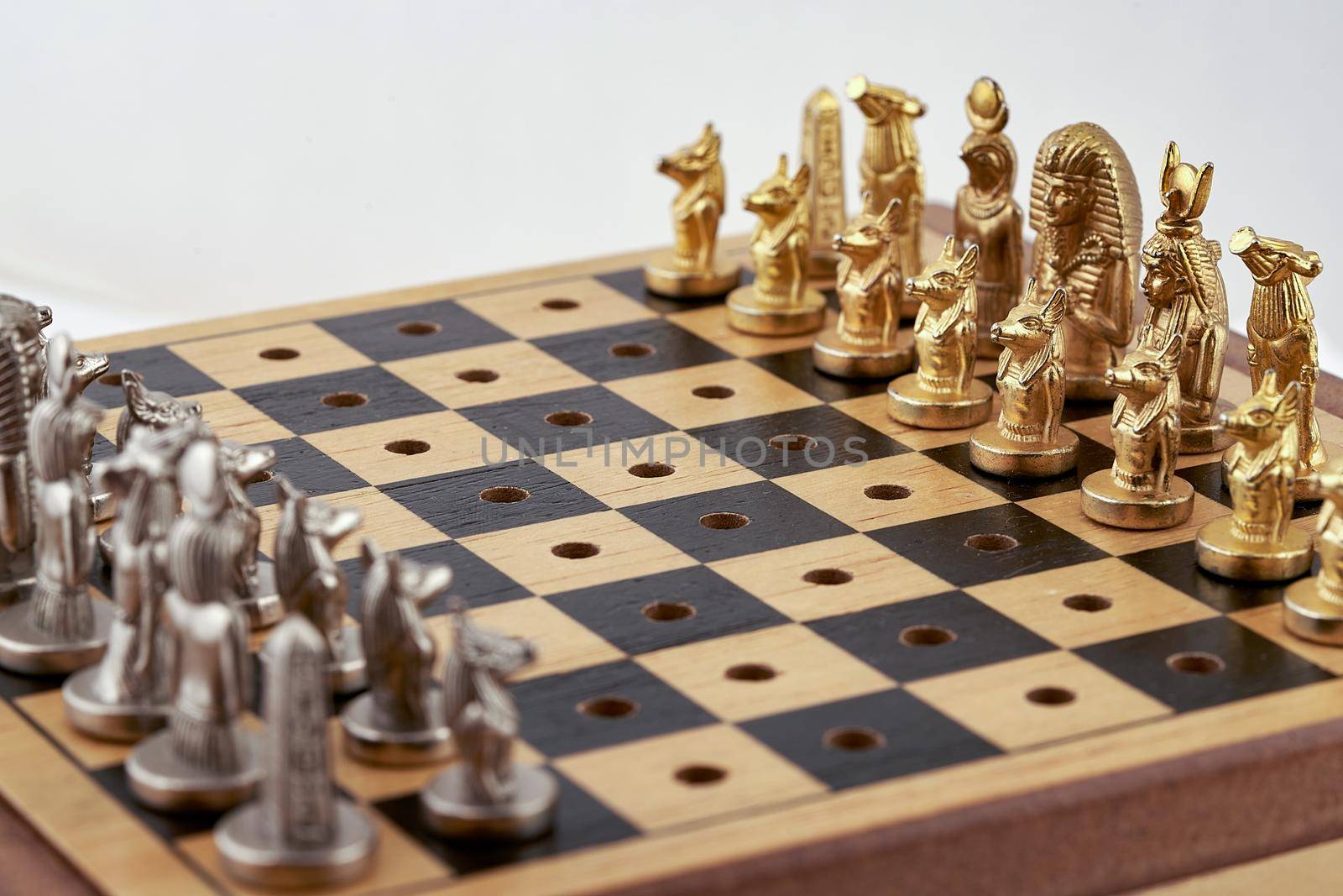 Chess pieces are placed on the board before the start of the game. Diagonal view