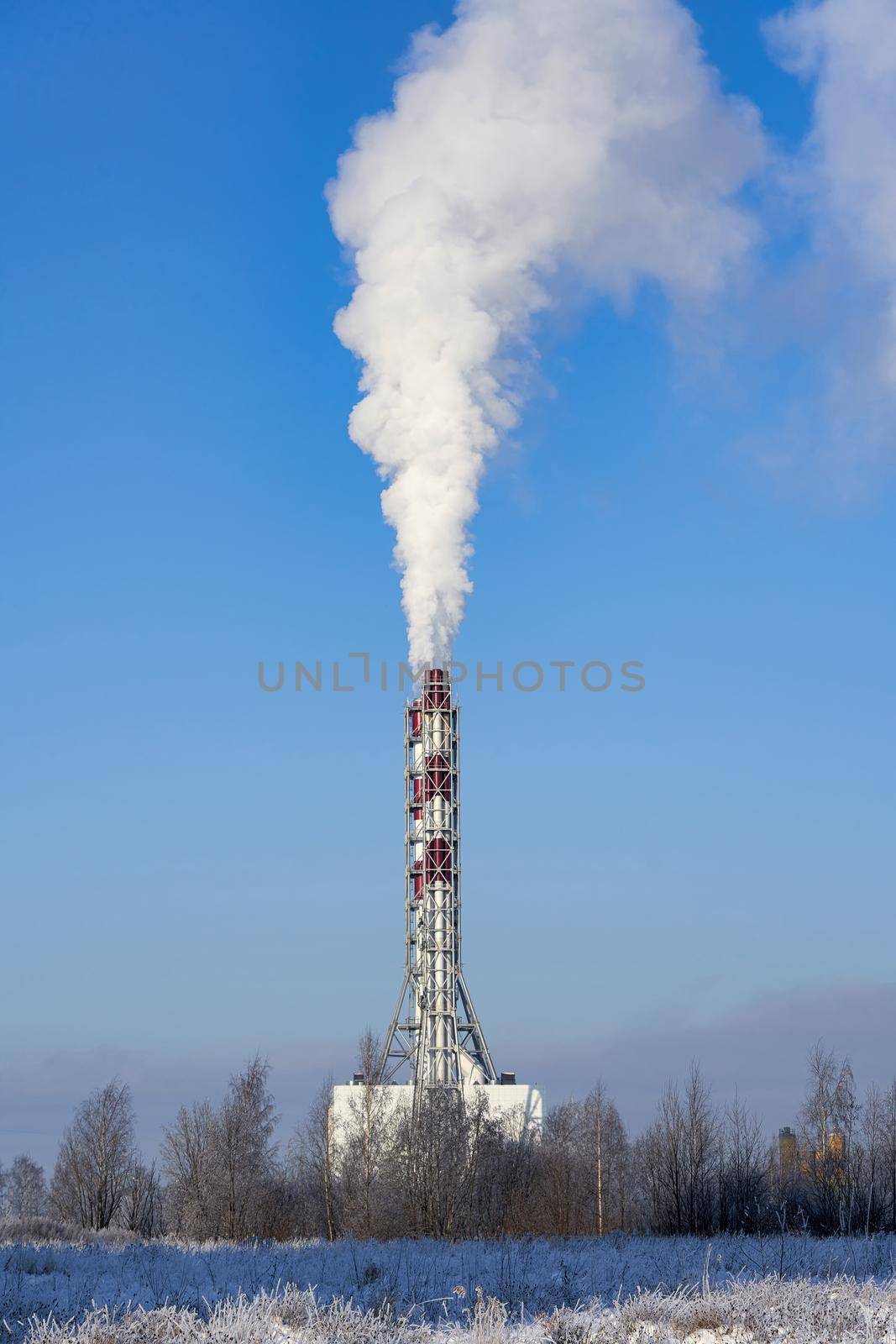 Smoke from a chimney against a blue sky by vizland