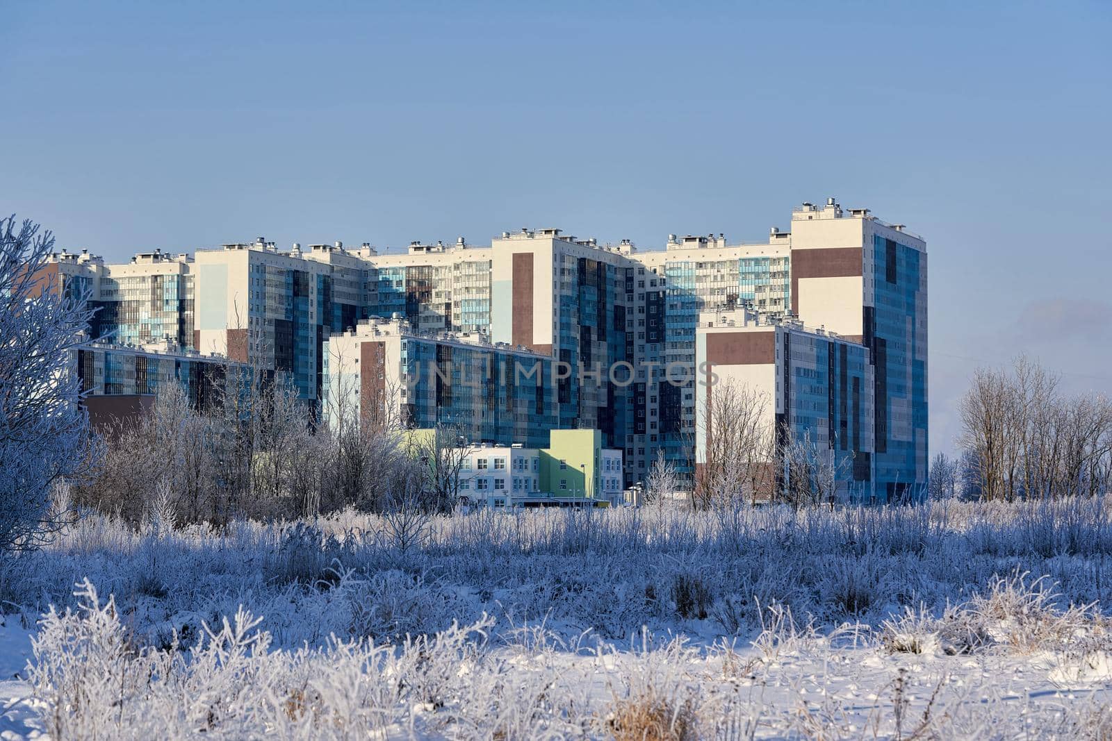 Residential houses on the edge of the city in winter by vizland