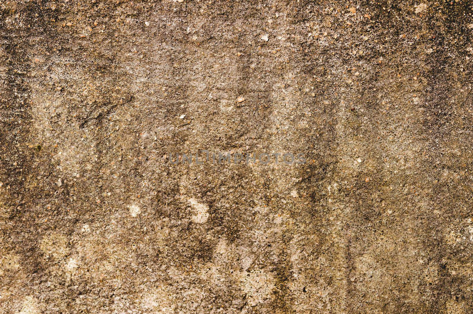 Close up Sand Wall Texture Pattern Background design element. Sandy effects on sandstone plaster pillar with minor cracks and uneven patches and highlighting Natural brown color shade. Copy Space