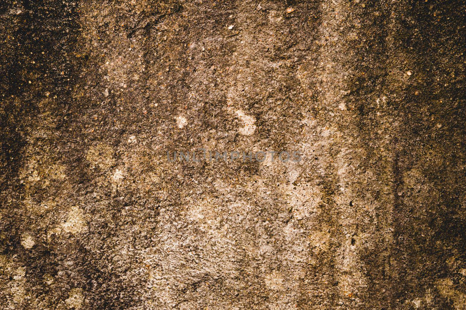 Moist Damp patch on Sand wall due to Rain penetration. Grunge crack moist concrete sand wall texture Pattern Background design element. Close up. Natural grungy color shade with minor uneven cracks. Sandy effects on building exterior plaster pillar. by sudiptabhowmick