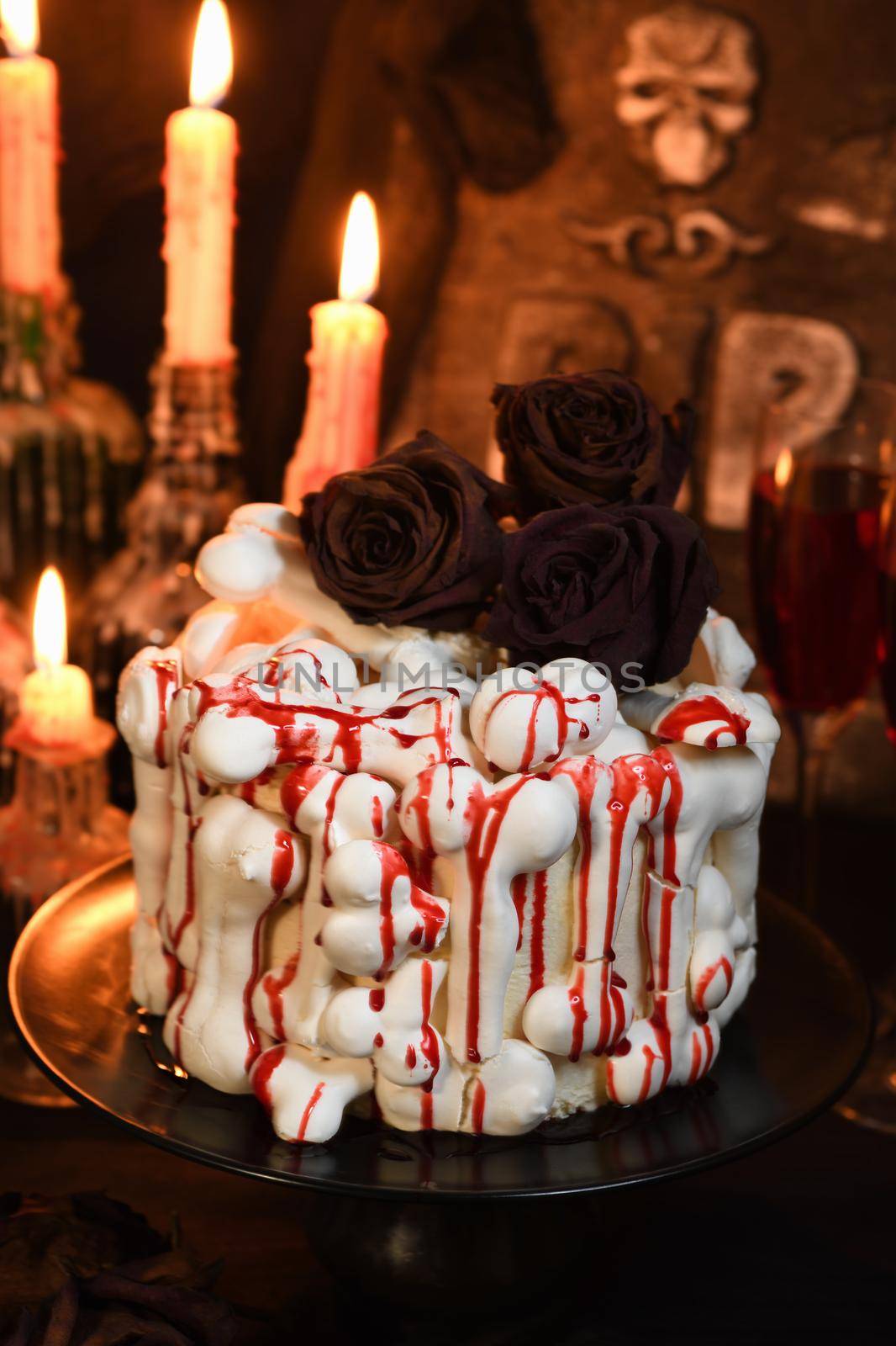 A  creepy cake (red velvet) decorated with meringue bones and drenched in blood. Great Halloween idea.  