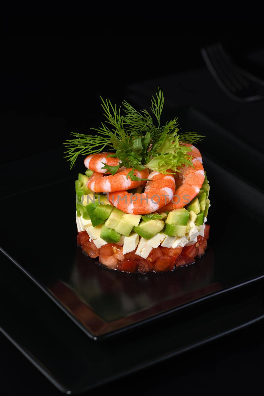  Tartare avocado   with mozzarella, tomatoes and shrimps.