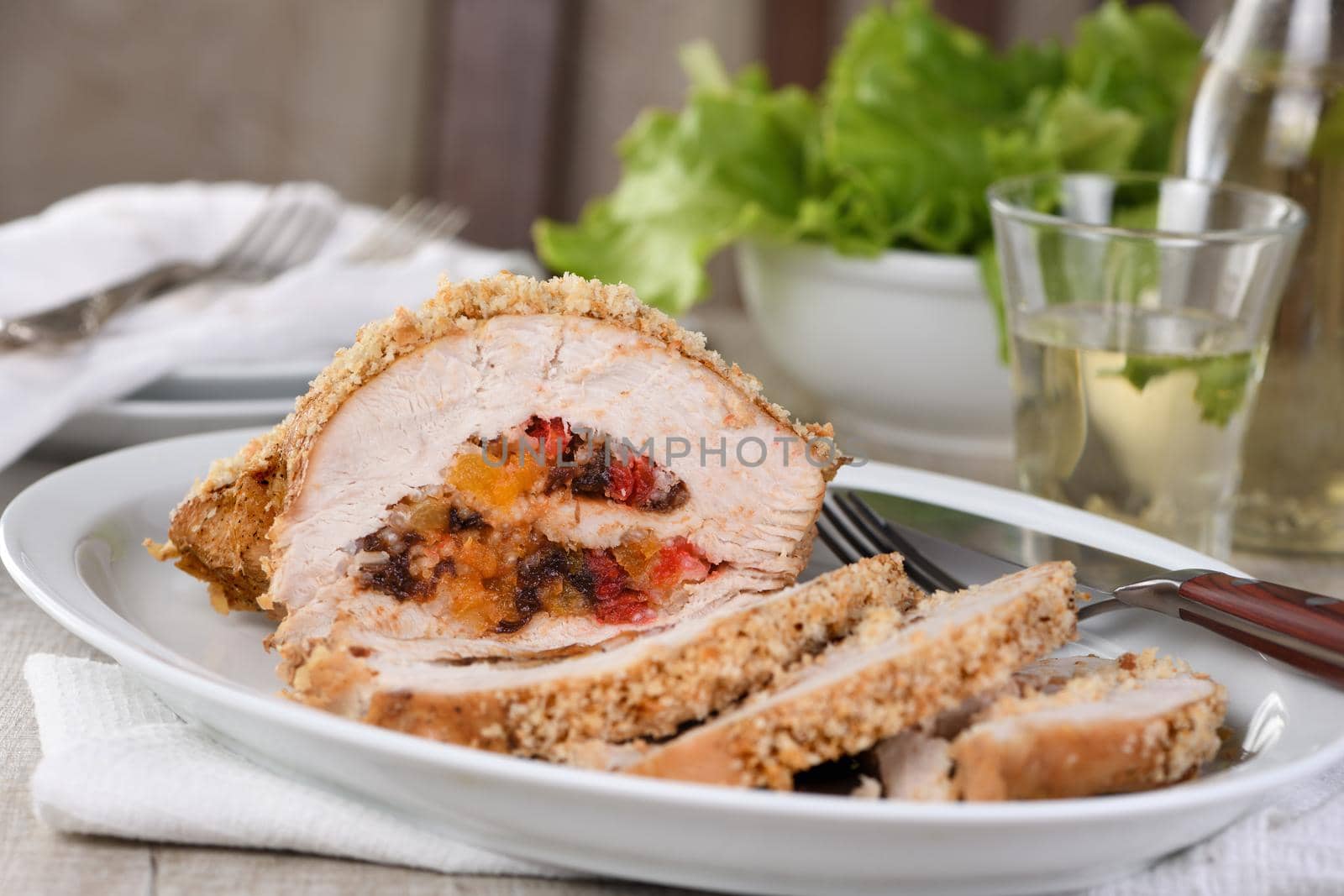 turkey breast stuffed with dried prunes, dried apricots and cherries in breadcrumbs and parmesan breading