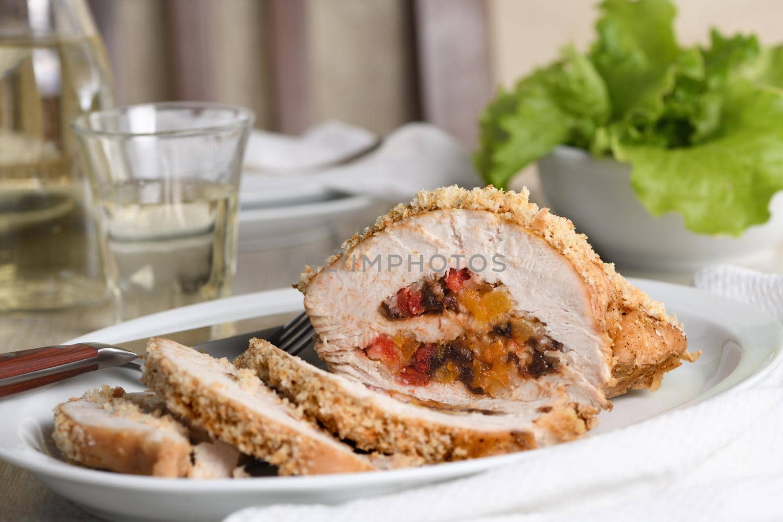 turkey breast stuffed with dried prunes, dried apricots and cherries in breadcrumbs and parmesan breading