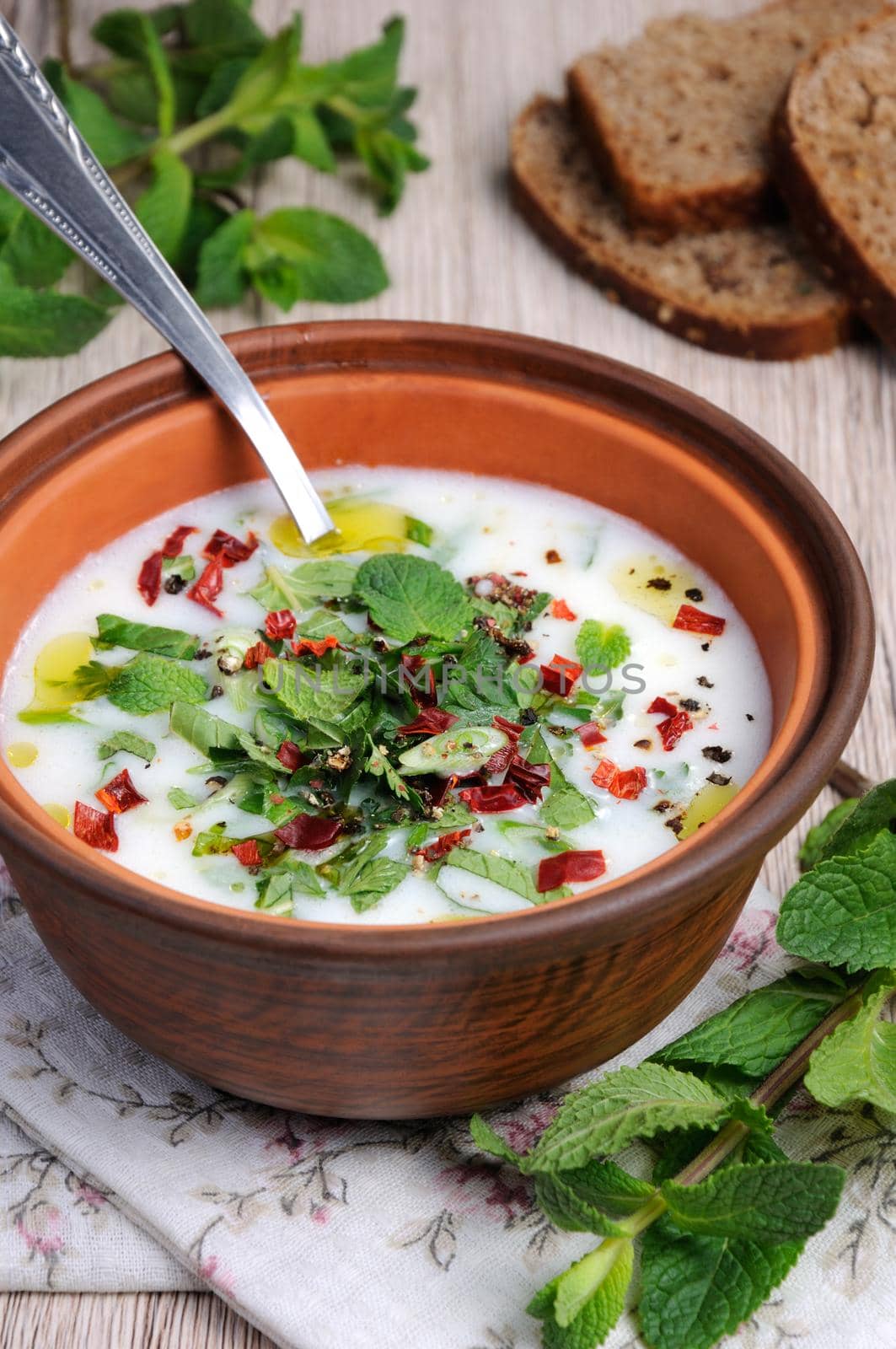 Refreshing сold summer soup the rice, mint and yoghurt, spices.  