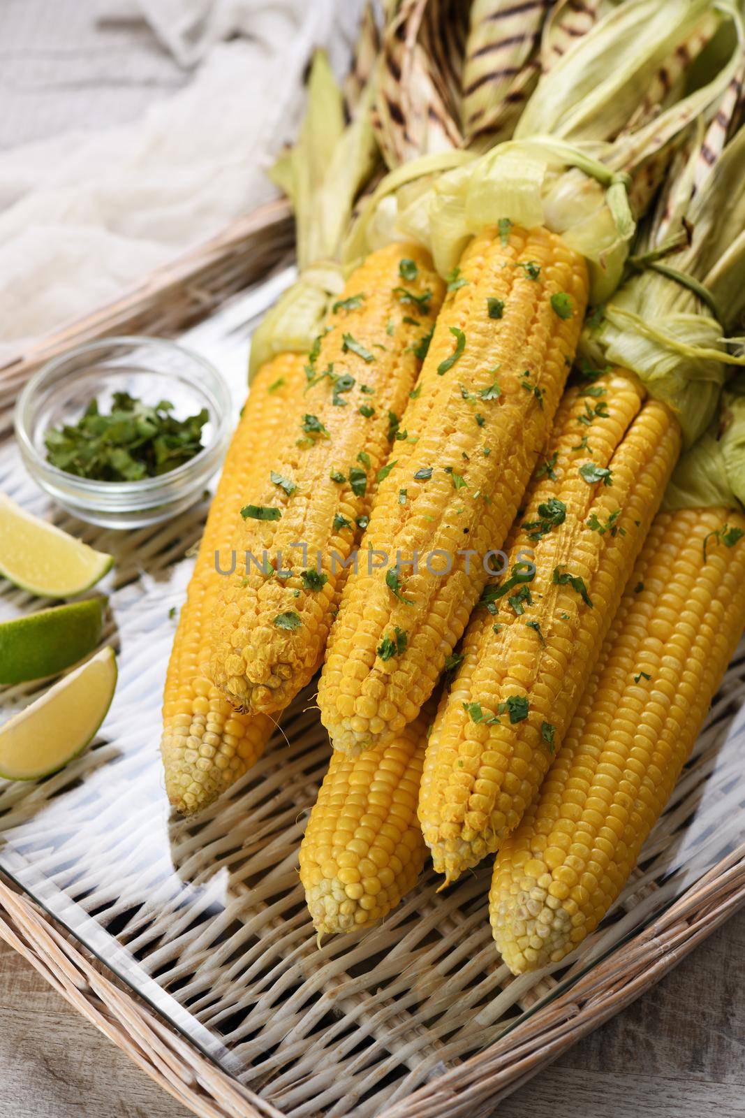 Tender, juicy grilled corn on the cob, seasoned butter with spicy curry and cilantro, grilled